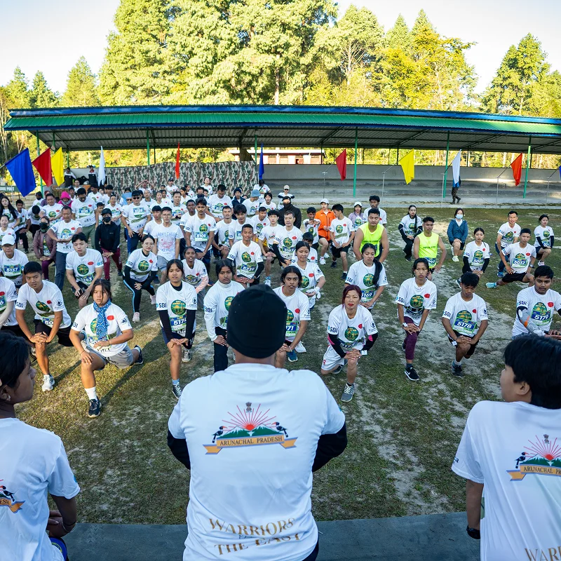 Participants warming up together at a previous Ziro Honour Run